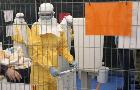 A volunteer for Medecins Sans Frontieres (MSF) receives training on how to handle personal protective equipment during courses in Brussels October 15, 2014, which is aimed to help deal with the Ebola disease in West Africa. PHOTO BY REUTERS/Francois Lenoir