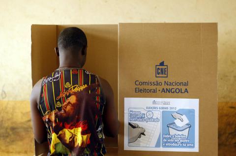 A man casts his vote at a polling station during the national elections in the capital Luanda, August 31, 2012. PHOTO BY REUTERS/Siphiwe Sibeko