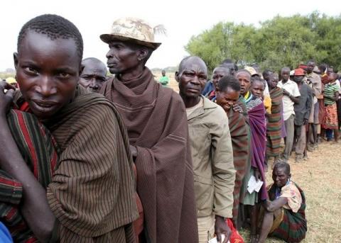 People from Karamojong tribe wait in line to vote at a polling station during the presidential elections in a village near town of Kaabong in Karamoja region, Uganda, February 18, 2016. PHOTO BY REUTERS/Goran Tomasevic