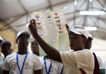 Members of the Burundian National Independent Electoral Commission count votes for the parliamentary elections at a polling station near Musaga neighbourhood in capital Bujumbura, June 29, 2015. PHOTO BY REUTERS/Paulo Nunes dos Santos