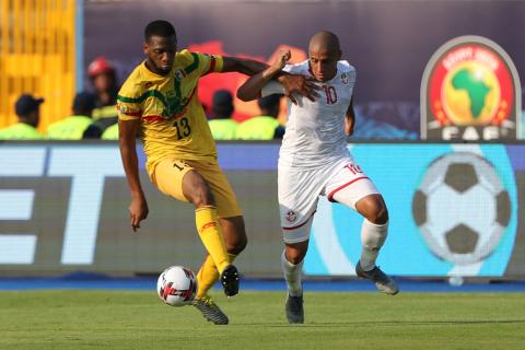 Tunisia's Wahbi Khazri in action with Mali's Molla Wague. PHOTO BY REUTERS/Suhaib Salem