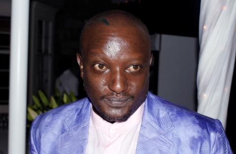 Kenyan writer Binyavanga Wainaina, who challenged stereotypes of Africa with biting satire and took on prejudice by documenting his life as an openly gay man, is seen at his an event in Nairobi, Kenya in this picture taken September 4, 2014. PHOTO BY REUTERS/Stringer