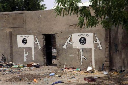 A wall painted by Boko Haram is pictured in Damasak March 24, 2015. PHOTO BY REUTERS/Joe Penney