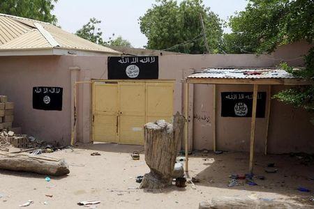 A wall painted by Boko Haram is seen in Damasak March 24, 2015. PHOTO BY REUTERS/Joe Penney