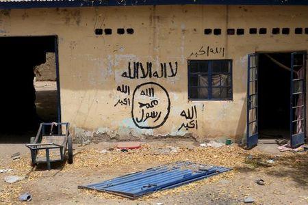 A wall painted by Boko Haram is seen in Damasak, March 24, 2015. PHOTO BY REUTERS/Joe Penney