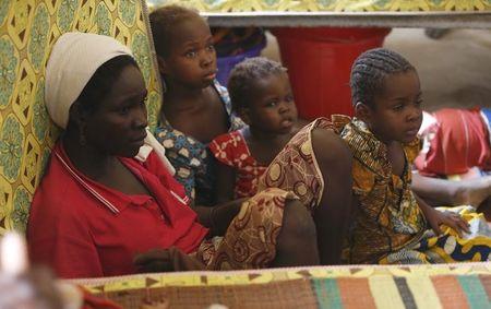 A woman, who was freed by the Nigerian army from Boko Haram militants in the Sambisa forest, sits with her children at the Malkohi camp for internally displaced people in Yola, Nigeria, May 3, 2015. PHOTO BY REUTERS/Afolabi Sotunde