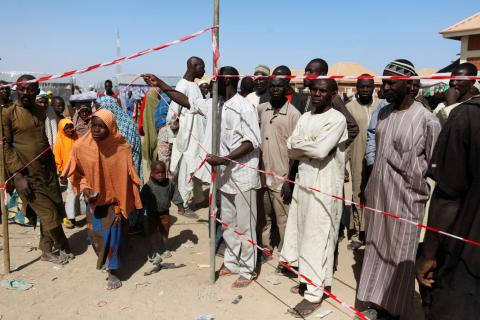 A woman makes her way through a cordoned-off area at the Teachers' Village IDP camp in Maiduguri, Nigeria January 16, 2019. PHOTO BY REUTERS/Afolabi Sotunde