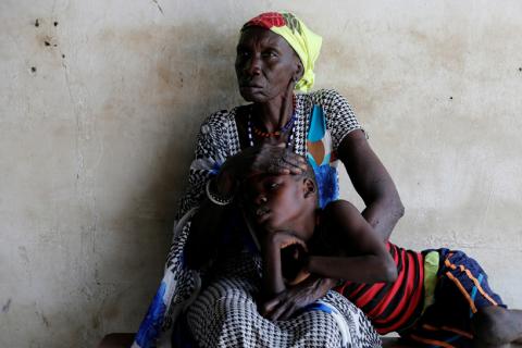 A woman comforts her son, who is suffering from malaria, as they wait for treatment at a Medecins Sans Frontieres (MSF) run clinic in the village of Likuangole, in Boma state, east South Sudan, February 1, 2017. PHOTO BY REUTERS/Siegfried Modola