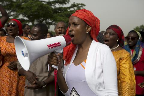 A woman demands for the release of 200 secondary school girls abducted in the remote village of Chibok, during a protest at Unity Park in Abuja