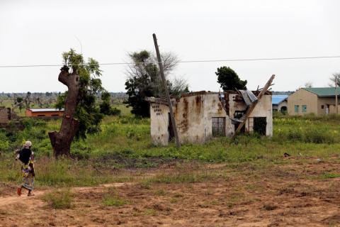 A woman walks toward a house damaged by Boko Haram militants, along the Konduga-Bama road in Bama, Borno, Nigeria, August 31, 2016. PHOTO BY REUTERS/Afolabi Sotunde