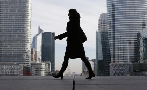 A Businesswoman is silhouetted as she makes her way under the Arche de la Defense, in the financial district west of Paris, November 20, 2012. PHOTO BY REUTERS/Christian Hartmann