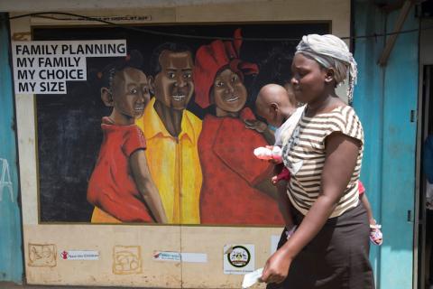 A woman walks past a mural in the Kibera slums in Nairobi, Kenya, May 16, 2017. PHOTO BY REUTERS/Baz Ratner