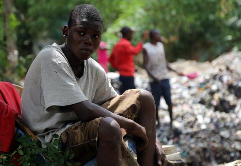 A boy sits near their destroyed house at the scene of a landslide following torrential rains near the University of Kinshasa, in the Democratic Republic of Congo, November 27, 2019. PHOTO BY REUTERS/Kenny Katombe