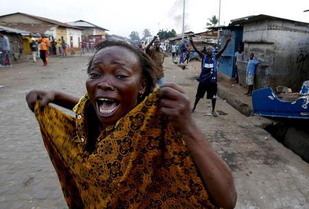 A female protester shouts at policemen (not pictured) during a protest against Burundi President Pierre Nkurunziza and his bid for a third term in Bujumbura, Burundi, May 26, 2015. PHOTO BY REUTERS/Goran Tomasevic