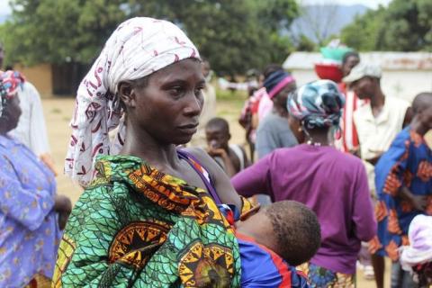 A woman queues for food at a World Food Programme distribution point in Freetown, October 18, 2014. PHOTO BY REUTERS/Josephus Olu-Mamma