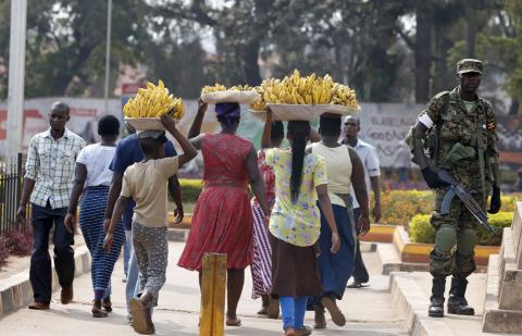 Women carry baskets of banana in Uganda's capital Kampala, February 19, 2016. PHOTO BY REUTERS/James Akena