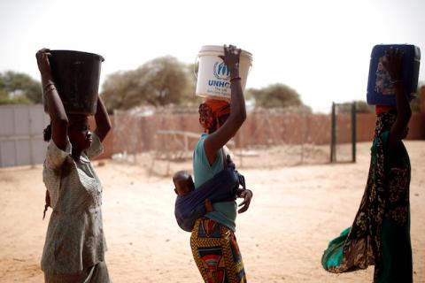 Women fetch water during the regional anti-insurgent Operation Barkhane in Tin Hama, Mali, October 19, 2017. PHOTO BY REUTERS/Benoit Tessier