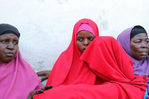 Qali Ibrahim, who lost her husband in the car bomb explosion, is consoled by an unknown relative during a Reuters interview at the Madina hospital in Mogadishu, Somalia, on December 28, 2019. PHOTO BY REUTERS/Feisal Omar