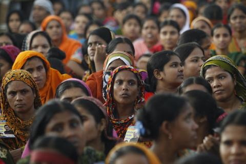 Garment workers listen to speakers during a rally demanding an increase to their minimum wage in Dhaka, September 21, 2013. PHOTO BY EUTERS/Andrew Biraj