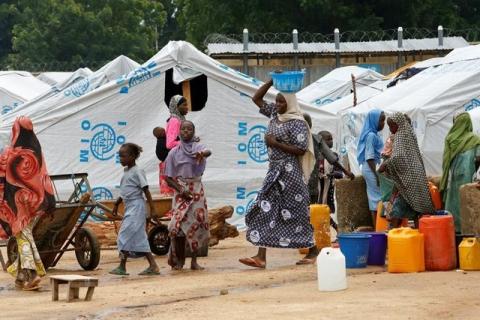 Women gather at a water collecting point at the internally displaced people's camp in Bama, Borno State, Nigeria, August 31, 2016. PHOTO BY REUTERS/Afolabi Sotunde