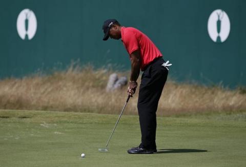 Tiger Woods of the U.S. putts on the 18th green during the final round of the British Open Championship at the Royal Liverpool Golf Club in Hoylake, northern England