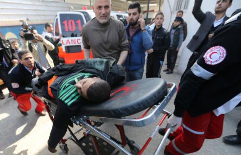 A wounded Palestinian is brought into a hospital following what police said was an Israeli air strike in Rafah in the southern Gaza Strip, February 27, 2017. PHOTO BY REUTERS/Ibraheem Abu Mustafa