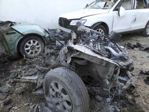 The wreckage of a car, which was destroyed when a bomb exploded, is pictured next to the Egyptian embassy in the Libyan capital of Tripoli, November 13, 2014. PHOTO BY REUTERS/Stringer