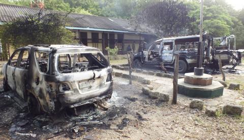 Wreckages of burnt cars are seen outside the Mpeketoni police station after unidentified gunmen attacked the coastal Kenyan town of Mpeketoni