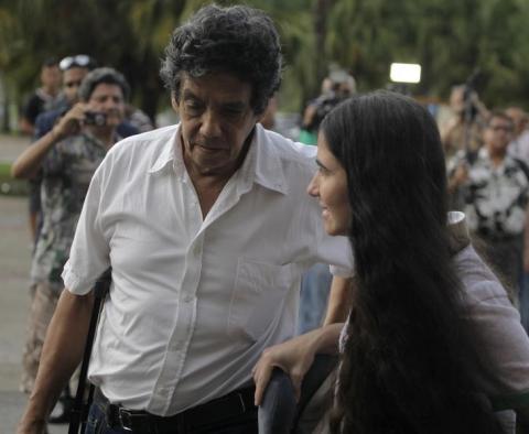 Cuba's best-known dissident, blogger Yoani Sanchez, walks with her husband Reinaldo Escobar outside Havana's Jose Marti International Airport, May 30, 2013. PHOTO BY REUTERS/Desmond Boylan