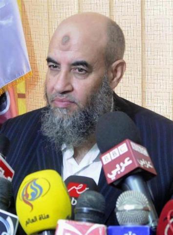 Younes Makhyoun, head of the Salafist al-Nour Party, speaks during a news conference at the party's headquarters in Cairo