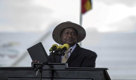 Uganda's President Yoweri Museveni holds the bible during his swearing-in ceremony at the Independance grounds in Uganda's capital Kampala, May 12, 2016. PHOTO BY REUTERS/Edward Echwalu