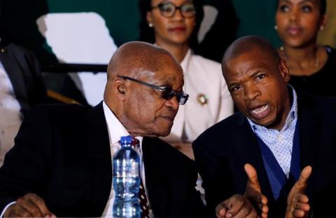 South Africa's former president Jacob Zuma chats with Premier of North West Province Supra Mahumapelo. PHOTO BY REUTERS/Siphiwe Sibeko