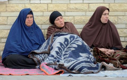 Relatives of victims of the explosion at Al-Rawda mosque, sit outside Suez Canal University hospital in Ismailia, Egypt, November 25, 2017. PHOTO BY REUTERS/Amr Abdallah Dalsh