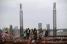 Construction workers are seen working on a site during a facility tour at the proposed Dangote oil refinery site near Akodo beach in the outskirt of Nigeria's commercial capital Lagos, June 25, 2016. PHOTO BY REUTERS/Akintunde Akinleye