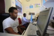 An internet cafe manager uses a computer in an internet cafe in the Hodan area of Mogadishu, October 9, 2013. PHOTO BY REUTERS/Feisal Omar