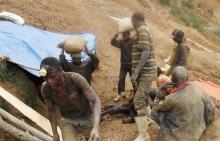 Artisanal gold miners carry sacks of sediment from gold tunnels at an illegal mine-pit in Walungu territory of South-Kivu province near Bukavu. PHOTO BY REUTERS/Kenny Katomb