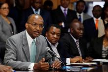 Kenya Central Bank Governor Patrick Njoroge addresses delegates during the launch of the first mobile-phone-based government bond, called M-Akiba, at the Treasury building in Nairobi, Kenya, March 23, 2017. PHOTO BY REUTERS/Thomas Mukoya