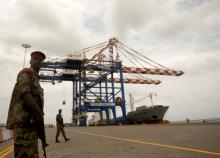 A Djibouti policeman stands guard during the opening ceremony of Dubai-based port operator DP World's Doraleh container terminal in Djibouti port, February 7, 2009. PHOTO BY REUTERS/Ahmed Jadallah