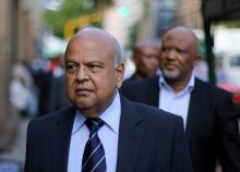 South Africa's Finance Minister Pravin Gordhan walks with his deputy, Mcebisi Jonas as they walk from their offices to a court hearing in Pretoria, South Africa, March 28,2017. PHOTO BY REUTERS/Siphiwe Sibeko