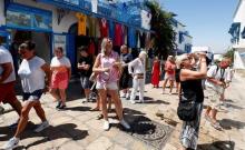 Tourists walk in Sidi Bou Said, an attractive tourist destination near Tunis, Tunisia, July 18, 2017. PHOTO BY REUTERS/Zoubeir Souissi