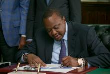 Kenya's President Uhuru Kenyatta signs into law the Finance Bill 2019 at State House in Nairobi, Kenya, November 7, 2019. PHOTO BY REUTERS/Presidential Press Service/Handout