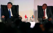South African President Cyril Ramaphosa and China's President Xi Jinping sit together during the BRICS Summit in Johannesburg, South Africa, July 25, 2018. PHOTO BY REUTERS/Mike Hutchings