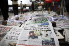 A newspaper is displayed at a vendor stand in Ikoyi district in Lagos