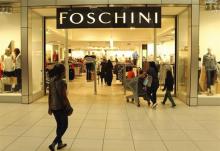 A shopper walks past a Foschini store at a shopping centre in Lenasia, south of Johannesburg