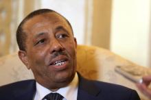 Libya's Prime Minister Abdullah al-Thinni speaks to reporters in Abu Dhabi