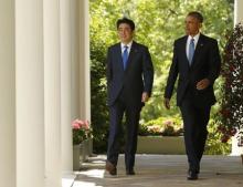 U.S. President Barack Obama (R) and Japanese Prime Minister Shinzo Abe arrive for a joint news conference in the Rose Garden of the White House in Washington, April 28, 2015. PHOTO BY REUTERS/Jonathan Ernst