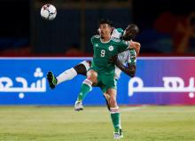 Algeria'a Baghdad Bounedjah in action with Senegal's Kalidou Coulibaly. PHOTO BY REUTERS/Amr Abdallah Dalsh