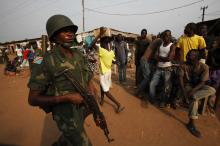 A soldier of the Democratic Republic of the Congo belonging to an African peacekeeping force, patrols on the streets of Bangui