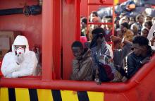 Migrants wait to disembark from tug boat Asso29 in the Sicilian harbour of Pozzallo, southern Italy, May 4, 2015. PHOTO BY REUTERS/Antonio Parrinello