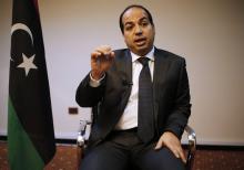 Libya's new Prime Minister Ahmed Maiteeq talks during an interview with Reuters in Tripoli